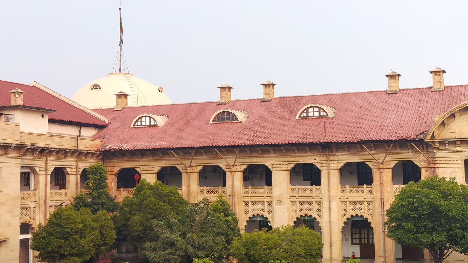 Inner block of the Allahabad High Court with a red roof and gardens