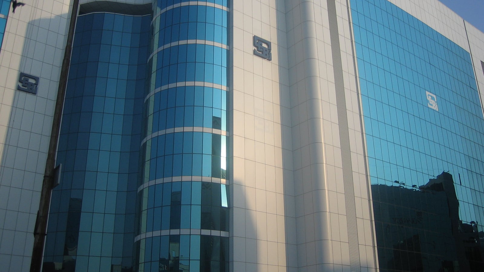 Blue glass facade of SEBI Bhavan in Mumbai's Bandra Kurla Complex