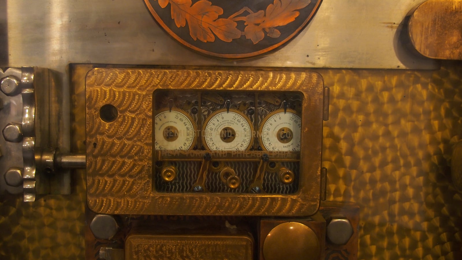 Brass combination dials and locks on an old vault door