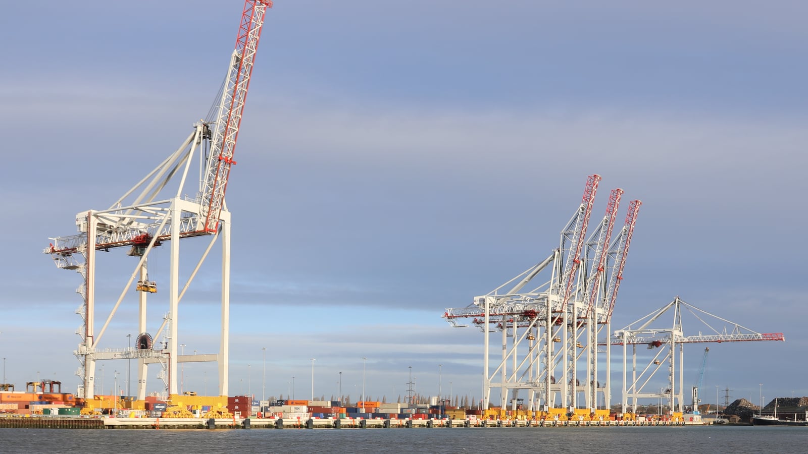 White container cranes along a quay